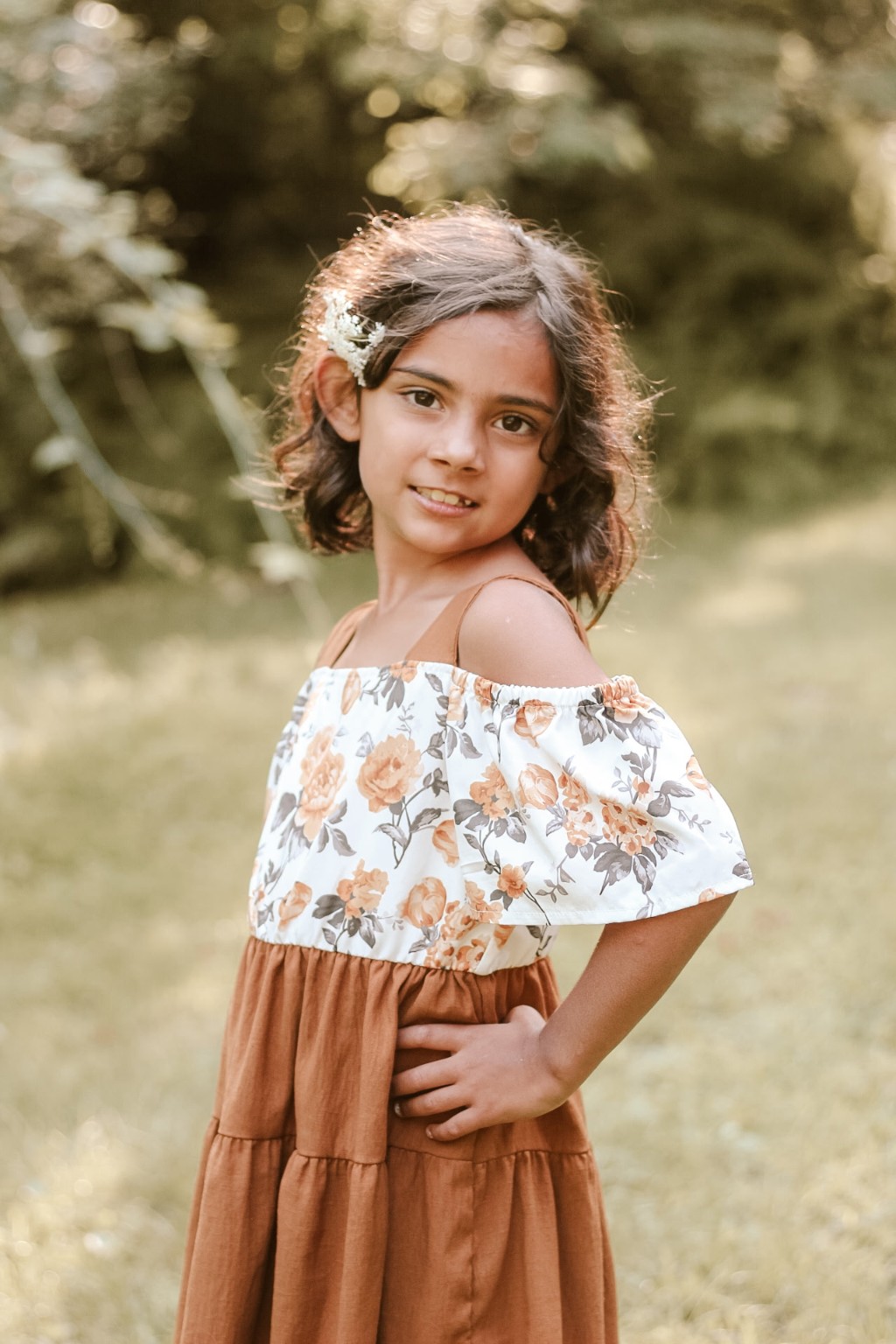 Smiling child in a floral dress